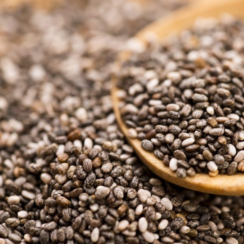 Nutritious chia seeds on a wooden spoon